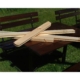 Stack of pine material boards for custom pallet components on a table.
