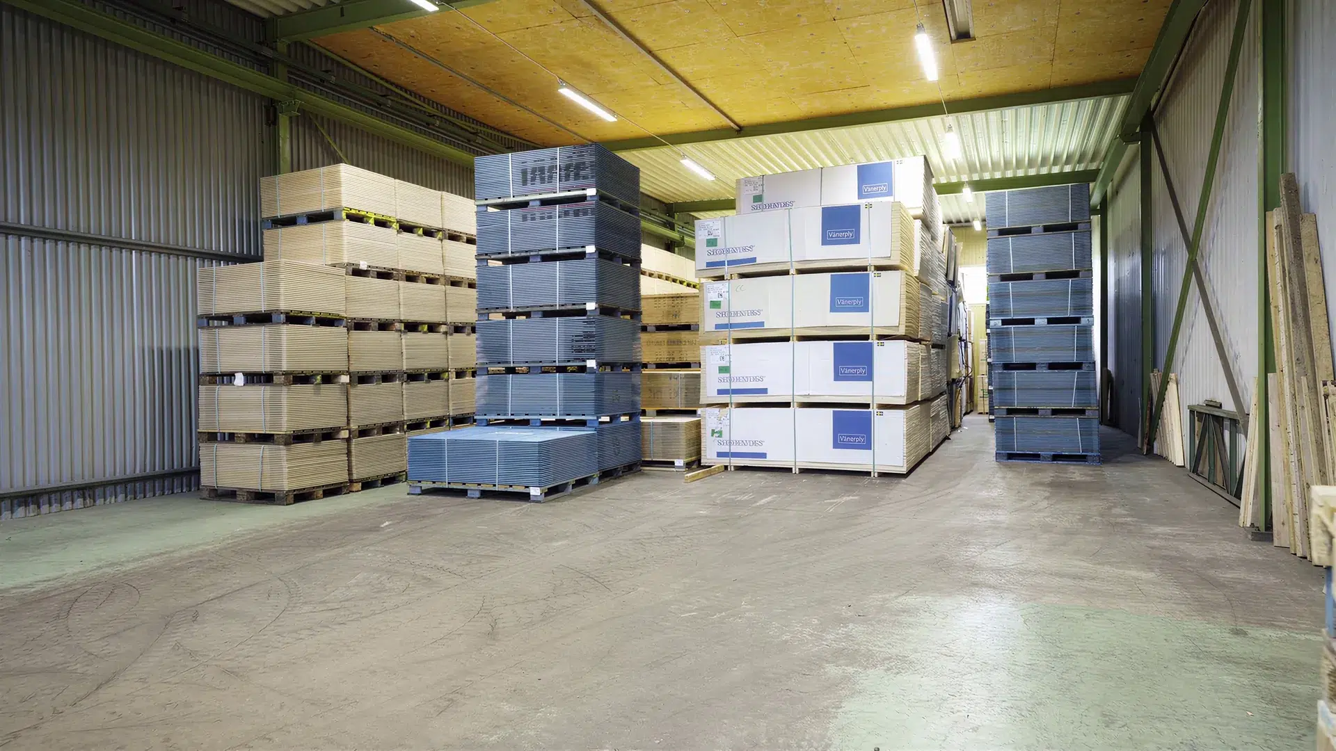 Stacks of packaged plywood in the warehouse at Kamrergatan 10.