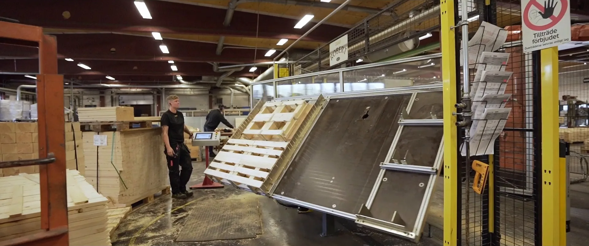 Operators at a pallet assembly station
